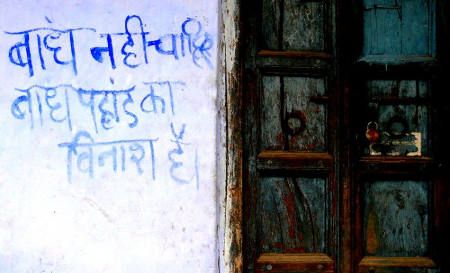 'We don't want dams, dams destroy  mountains' reads a slogan painted on a wall in Uttarakhand (Image Source: GJ Lingaraj)